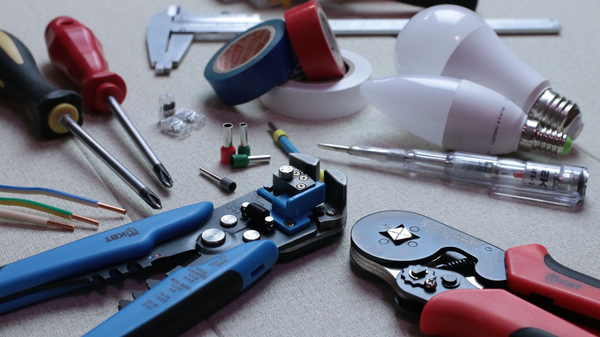 Electrical tools and components including wire strippers, screwdrivers, and bulbs