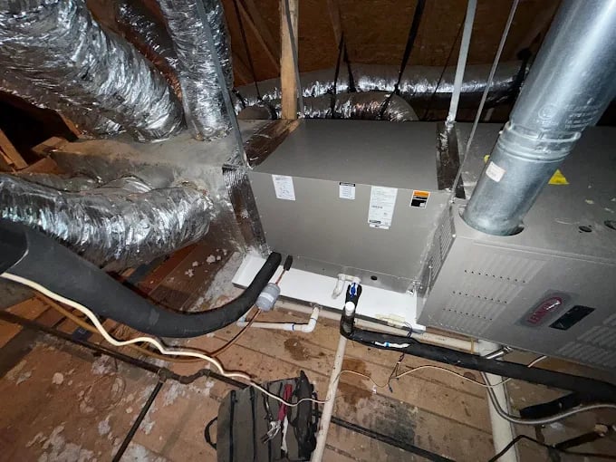 HVAC system with insulated ductwork in a residential attic space